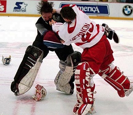 Patrick Roy of the Colorado Avalanche fights with Mike Vernon of the Detroit Red Wings